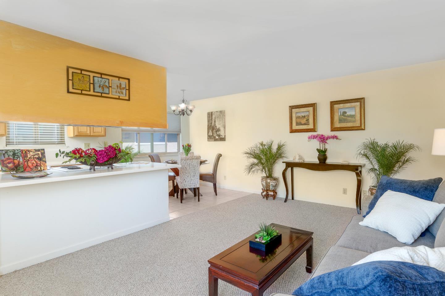 1375 Ruby Court, Unit 4 Capitola, CA 95010 - Photo 5 of 15 a living room with furniture and flowers
