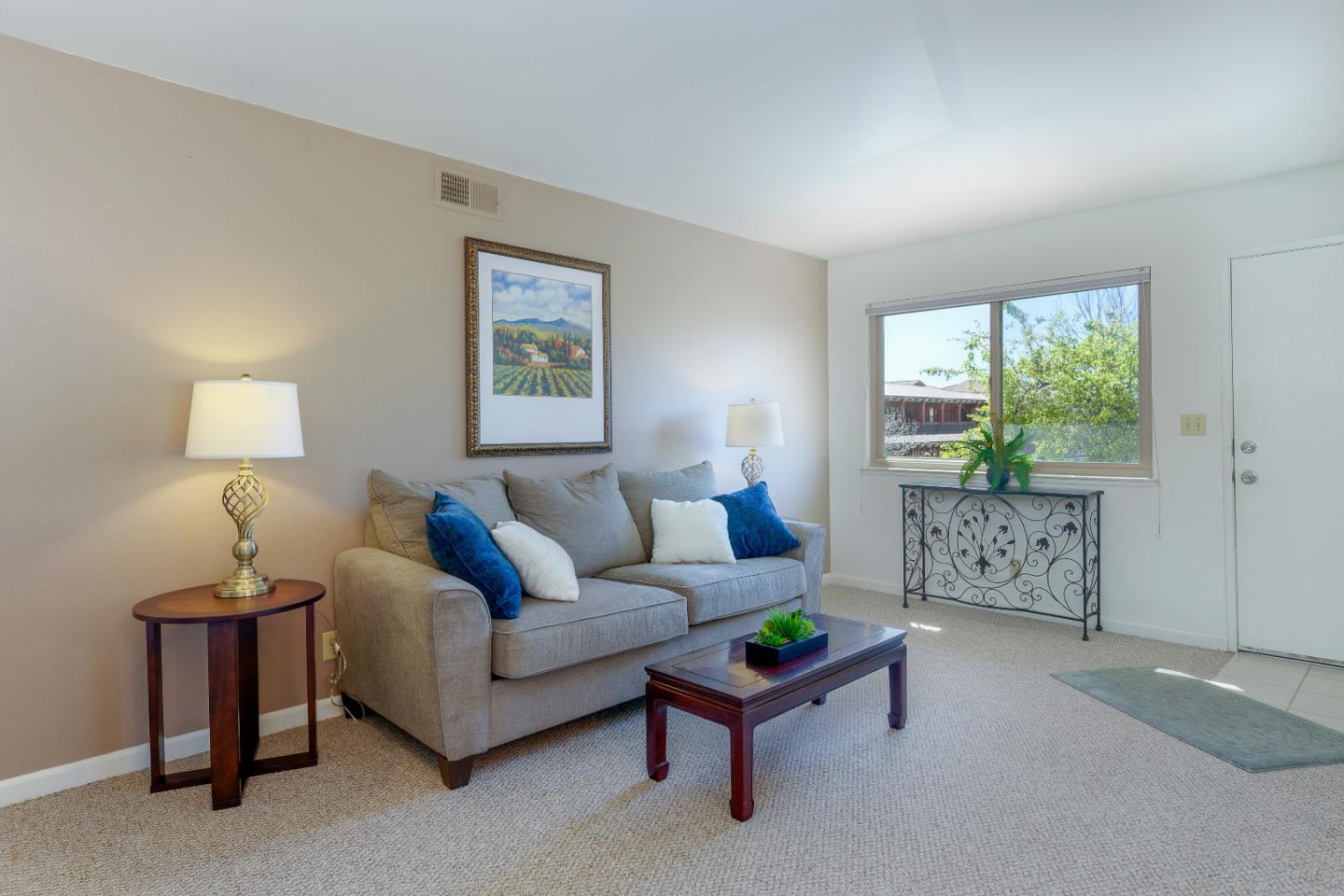 1375 Ruby Court, Unit 4 Capitola, CA 95010 - Photo 6 of 15 a living room with furniture a window and a table