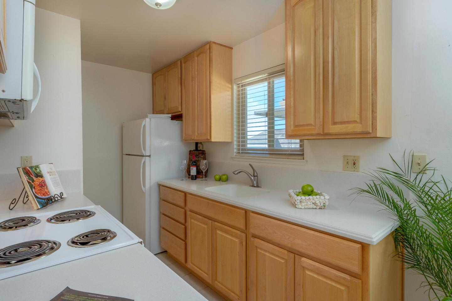1375 Ruby Court, Unit 4 Capitola, CA 95010 - Photo 9 of 15 a kitchen with sink a refrigerator and a stove