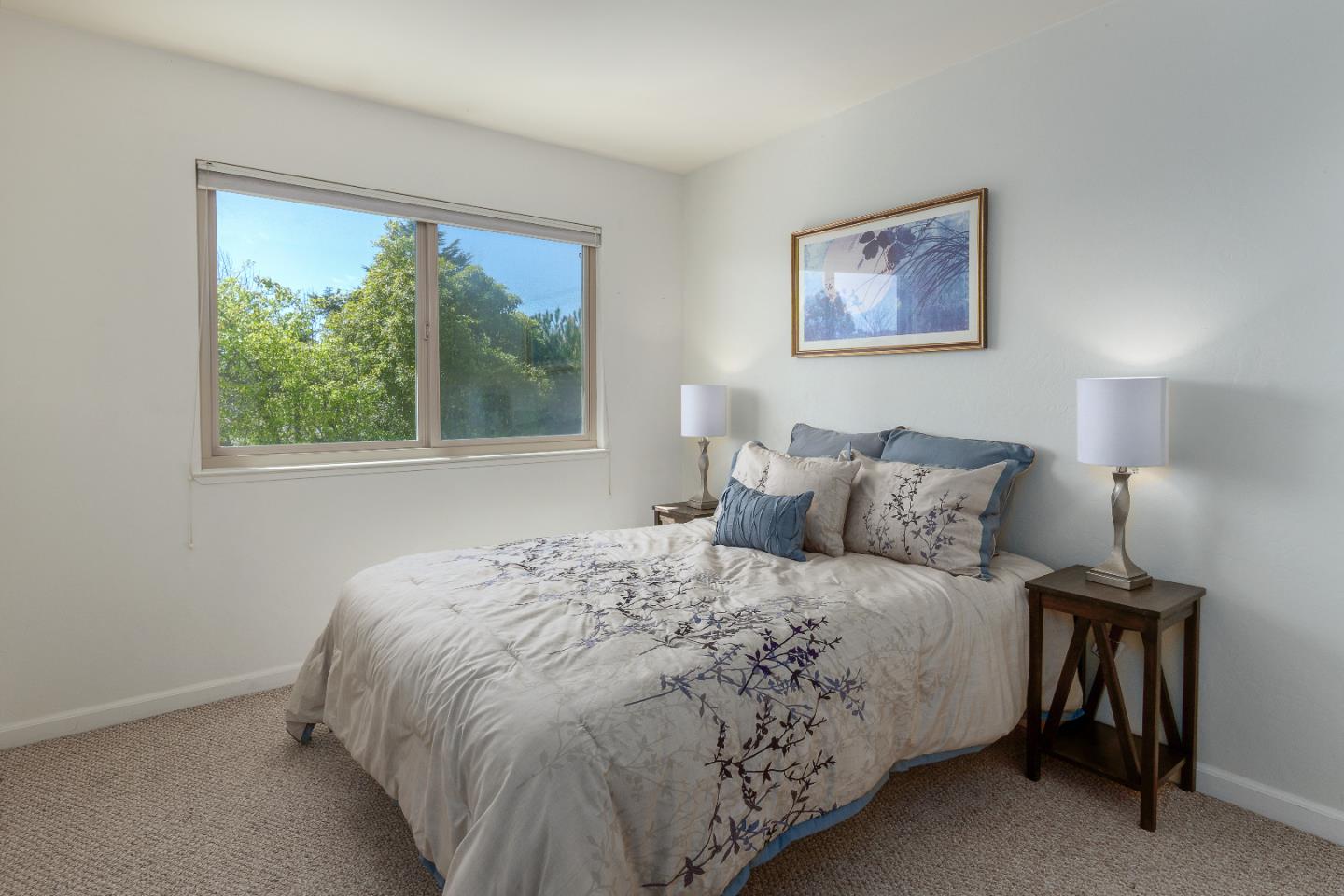 1375 Ruby Court, Unit 4 Capitola, CA 95010 - Photo 10 of 15 a bedroom with a bed and a window