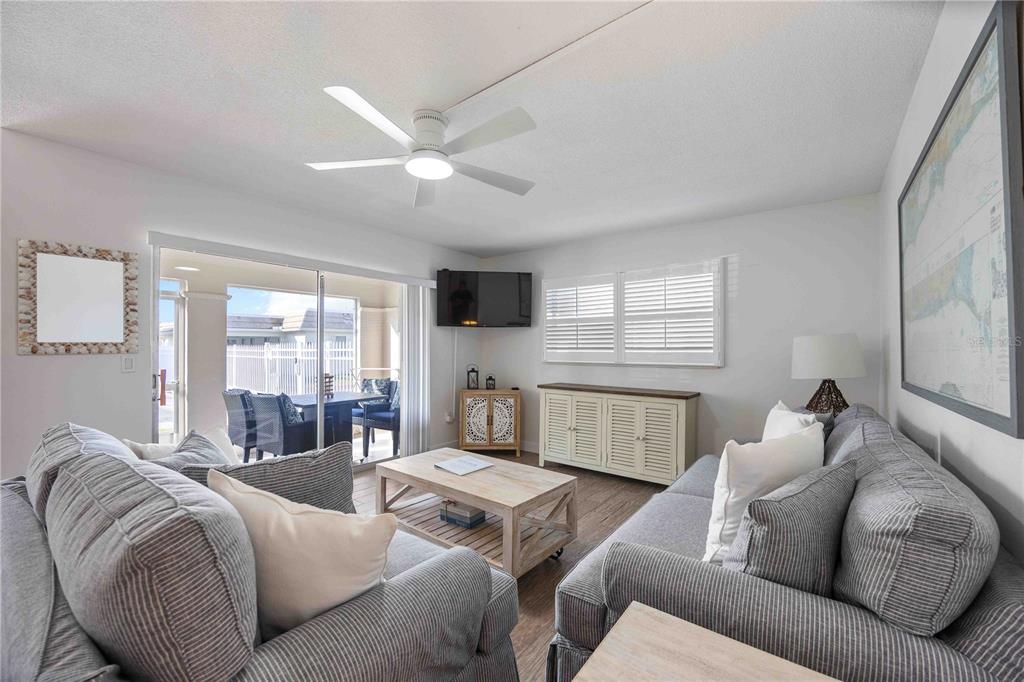 6150 Midnight Pass Road, Unit 10 A&B Sarasota, FL 34242 - Photo 13 of 65 a living room with furniture and a large window