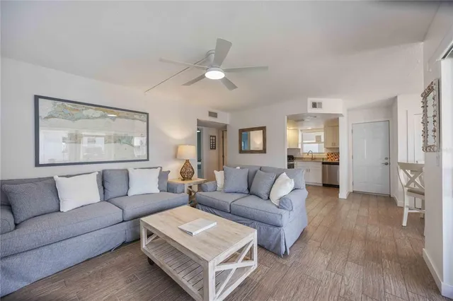 a bedroom with a bed and a ceiling fan