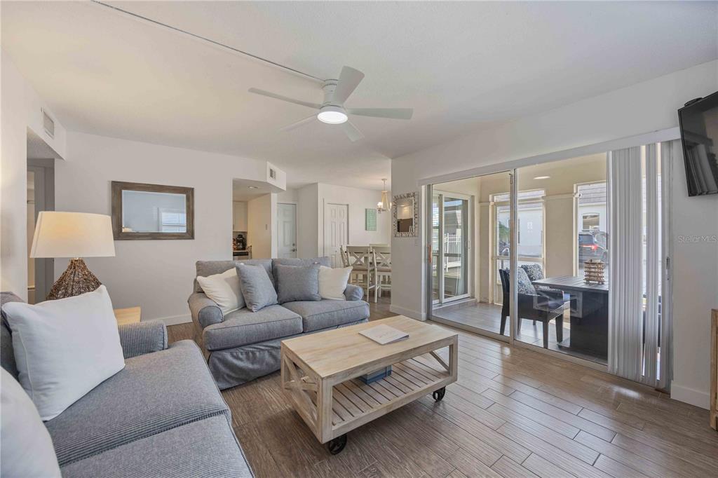 6150 Midnight Pass Road, Unit 10 A&B Sarasota, FL 34242 - Photo 15 of 65 a living room with furniture and wooden floor