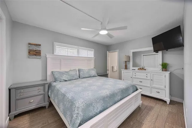 a bedroom with two beds and a window