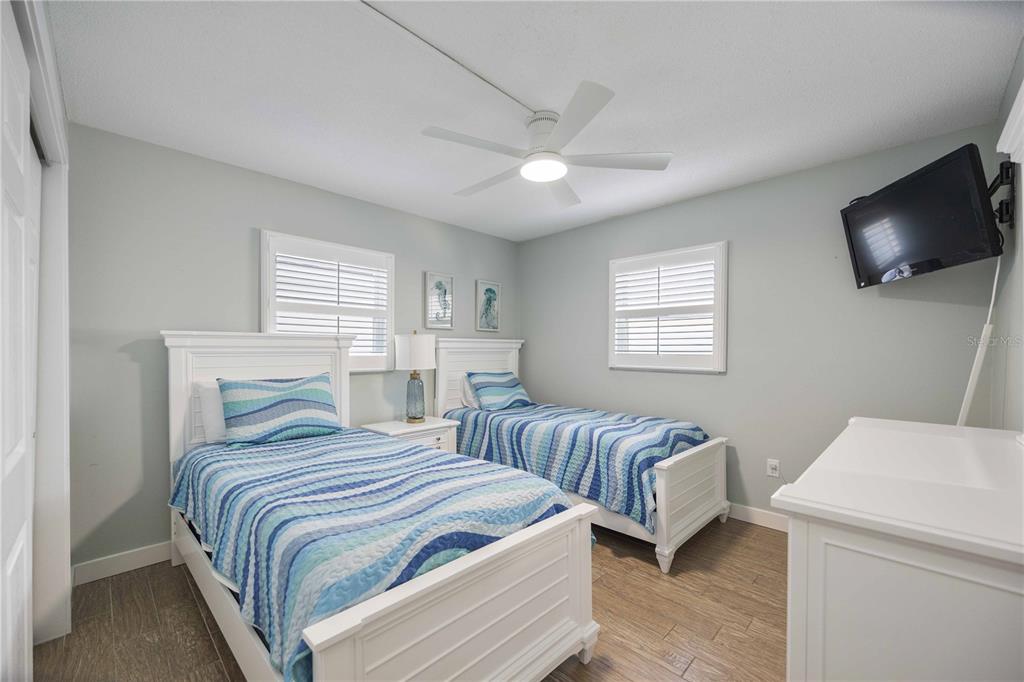 6150 Midnight Pass Road, Unit 10 A&B Sarasota, FL 34242 - Photo 22 of 65 a bedroom with two beds and a window