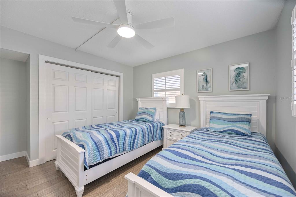 6150 Midnight Pass Road, Unit 10 A&B Sarasota, FL 34242 - Photo 24 of 65 a bedroom with double bed and a window