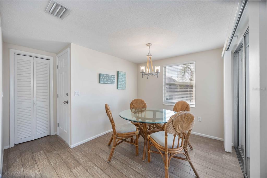 6150 Midnight Pass Road, Unit 10 A&B Sarasota, FL 34242 - Photo 28 of 65 a view of a dining room with furniture window and wooden floor