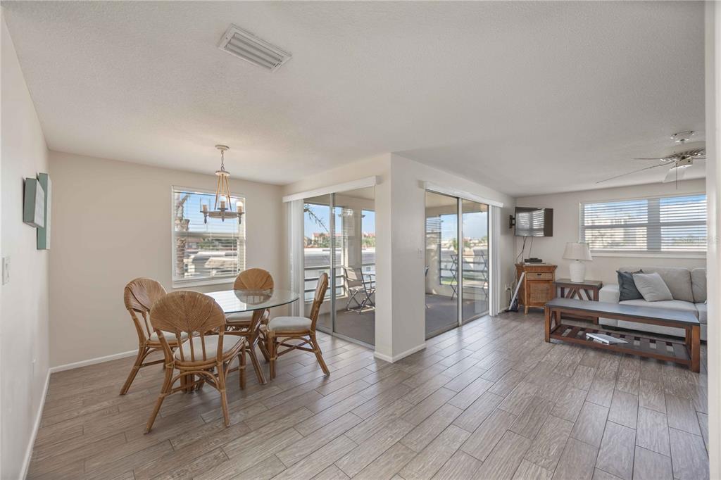 6150 Midnight Pass Road, Unit 10 A&B Sarasota, FL 34242 - Photo 36 of 65 a living room with furniture and wooden floor