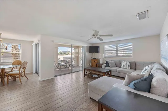 a bedroom with two beds and painting on the wall