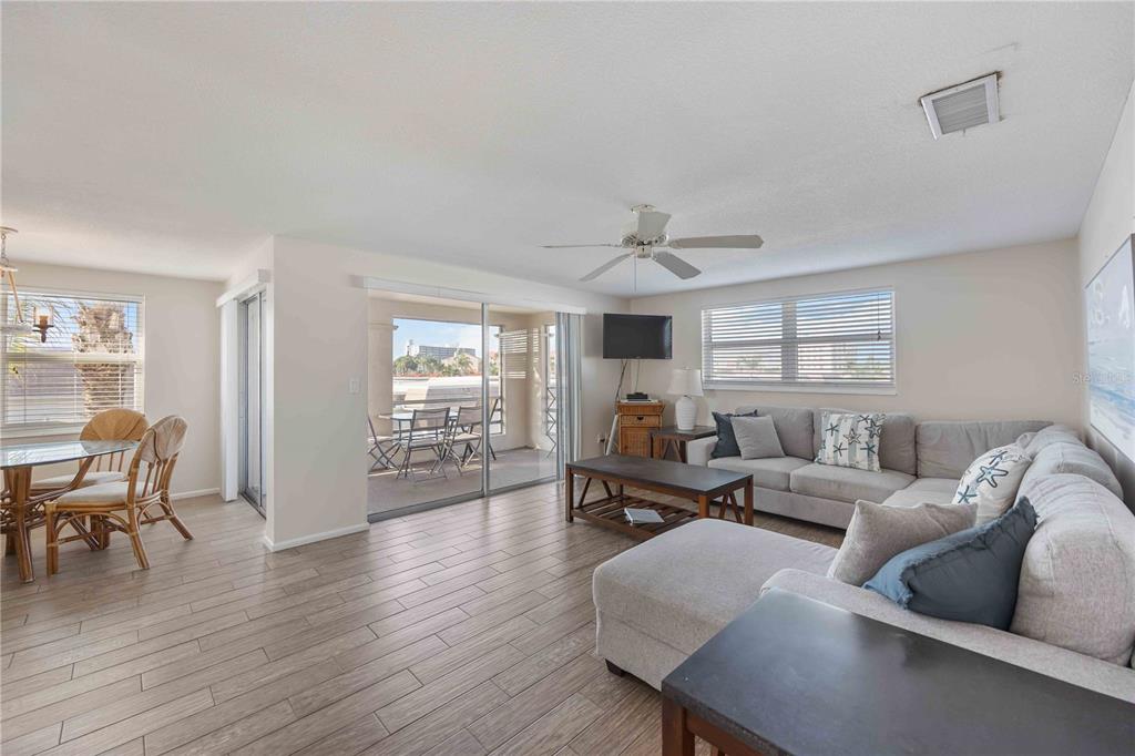 6150 Midnight Pass Road, Unit 10 A&B Sarasota, FL 34242 - Photo 38 of 65 a living room with furniture and wooden floor