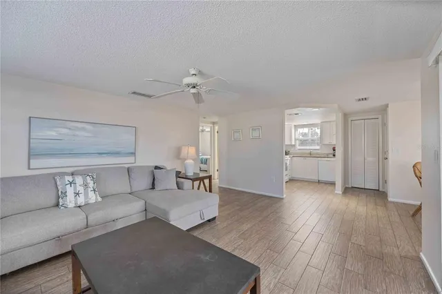 a bedroom with a bed and a night stand