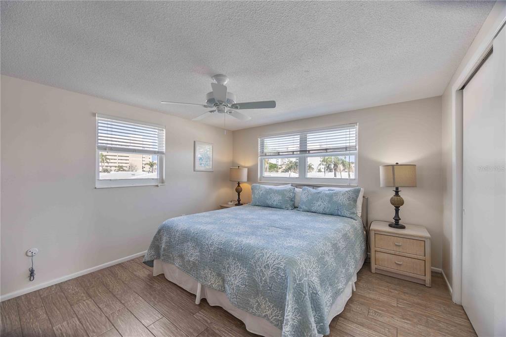 6150 Midnight Pass Road, Unit 10 A&B Sarasota, FL 34242 - Photo 47 of 65 a bedroom with a large bed and a window