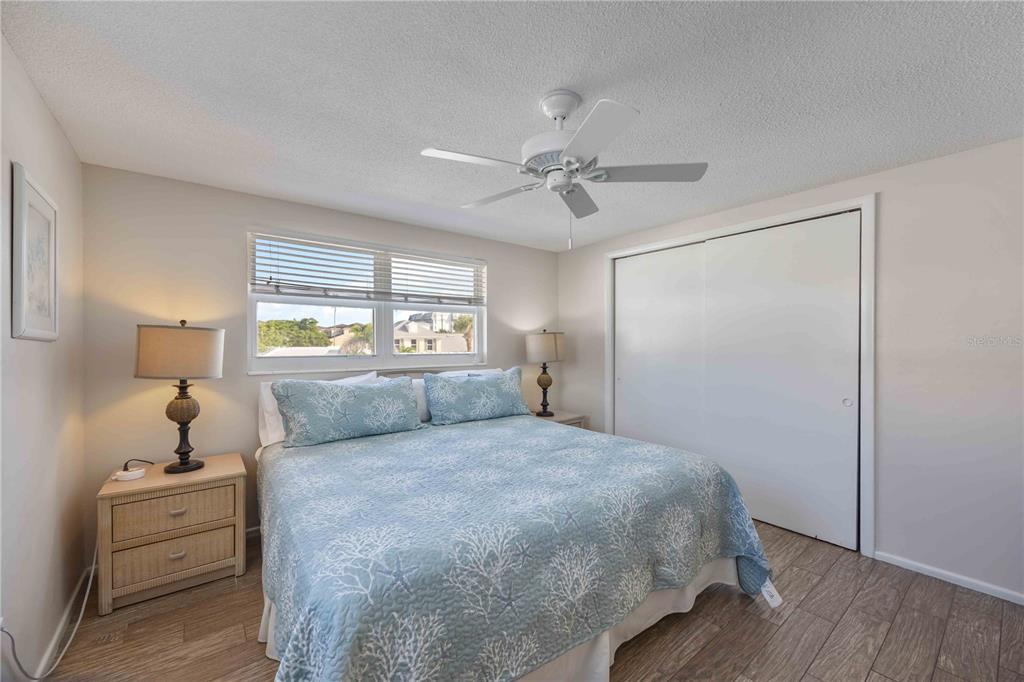 6150 Midnight Pass Road, Unit 10 A&B Sarasota, FL 34242 - Photo 48 of 65 a bedroom with a large bed and a window