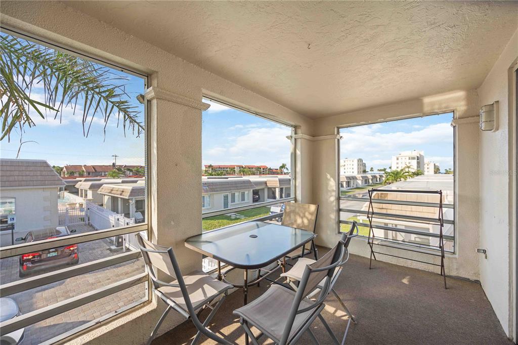 6150 Midnight Pass Road, Unit 10 A&B Sarasota, FL 34242 - Photo 50 of 65 a view of a dining room with furniture window and outside view