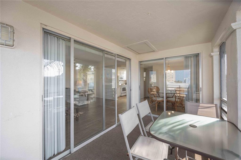 6150 Midnight Pass Road, Unit 10 A&B Sarasota, FL 34242 - Photo 52 of 65 a view of a dining room with furniture and wooden floor