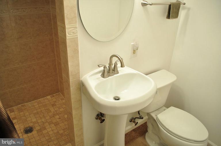 6106 Addison Road Capitol Heights, MD 20743 - Photo 13 of 25 lower level updated full bath, ceramic tile 6.10x3