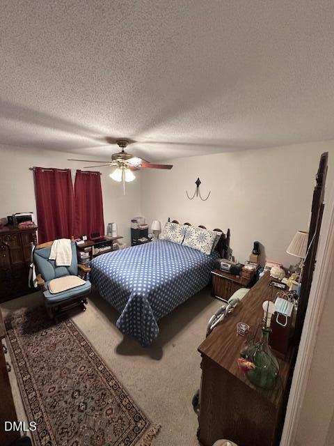 601 Fairfield Road Durham, NC 27704 - Photo 12 of 20 a bedroom with furniture and a chandelier