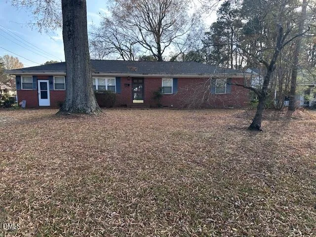 a view of a house with a yard and garage