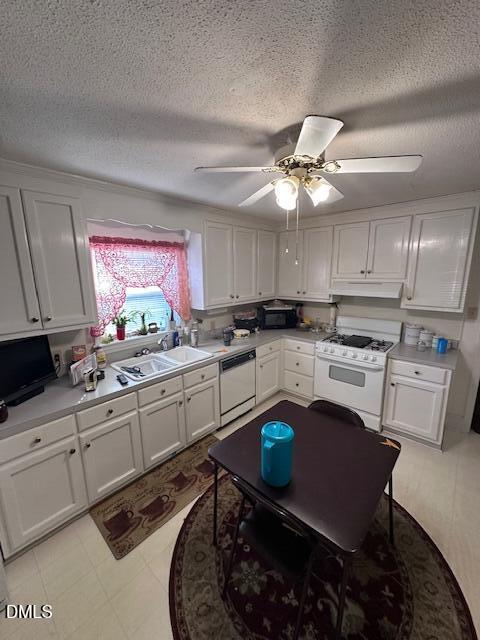 601 Fairfield Road Durham, NC 27704 - Photo 5 of 20 a kitchen with stainless steel appliances granite countertop a sink a stove a refrigerator cabinets and chairs