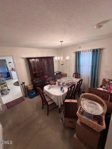 a room with furniture pool table gym equipment and a window