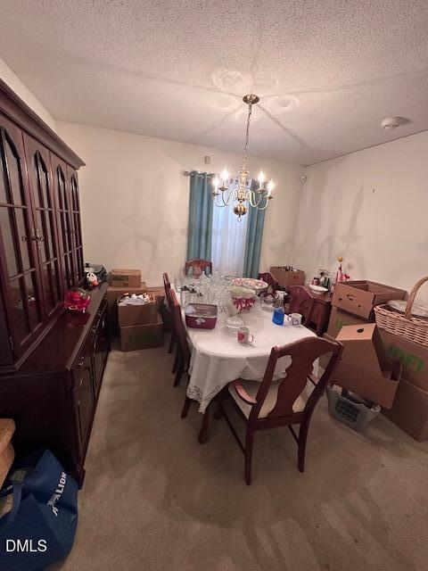 601 Fairfield Road Durham, NC 27704 - Photo 8 of 20 a dining room with furniture and a chandelier