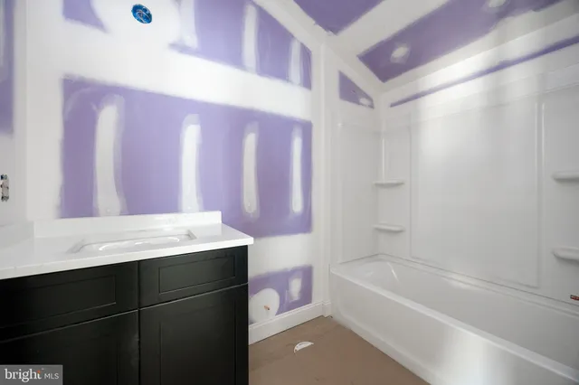 a picture of a bathroom with a window