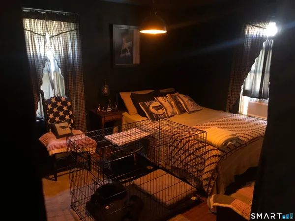 a bedroom with a bed and window