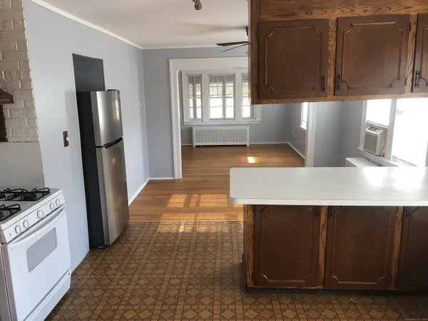 a kitchen with stainless steel appliances a refrigerator and a stove