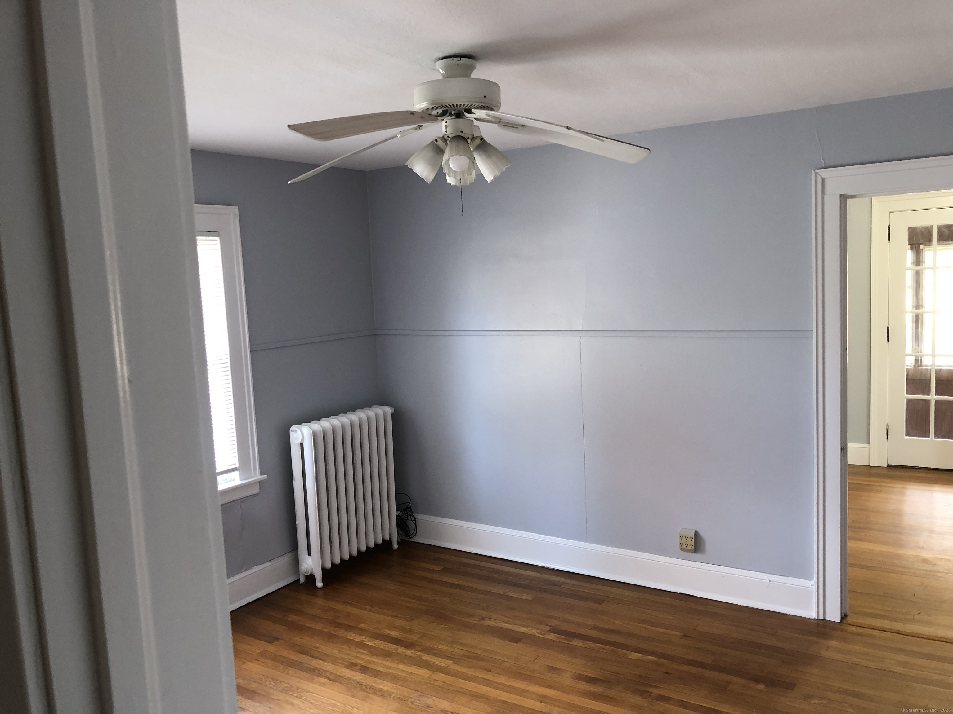 317-319 Garden Street Wethersfield, CT 06109 - Photo 19 of 24 wooden floor in an empty room with a window