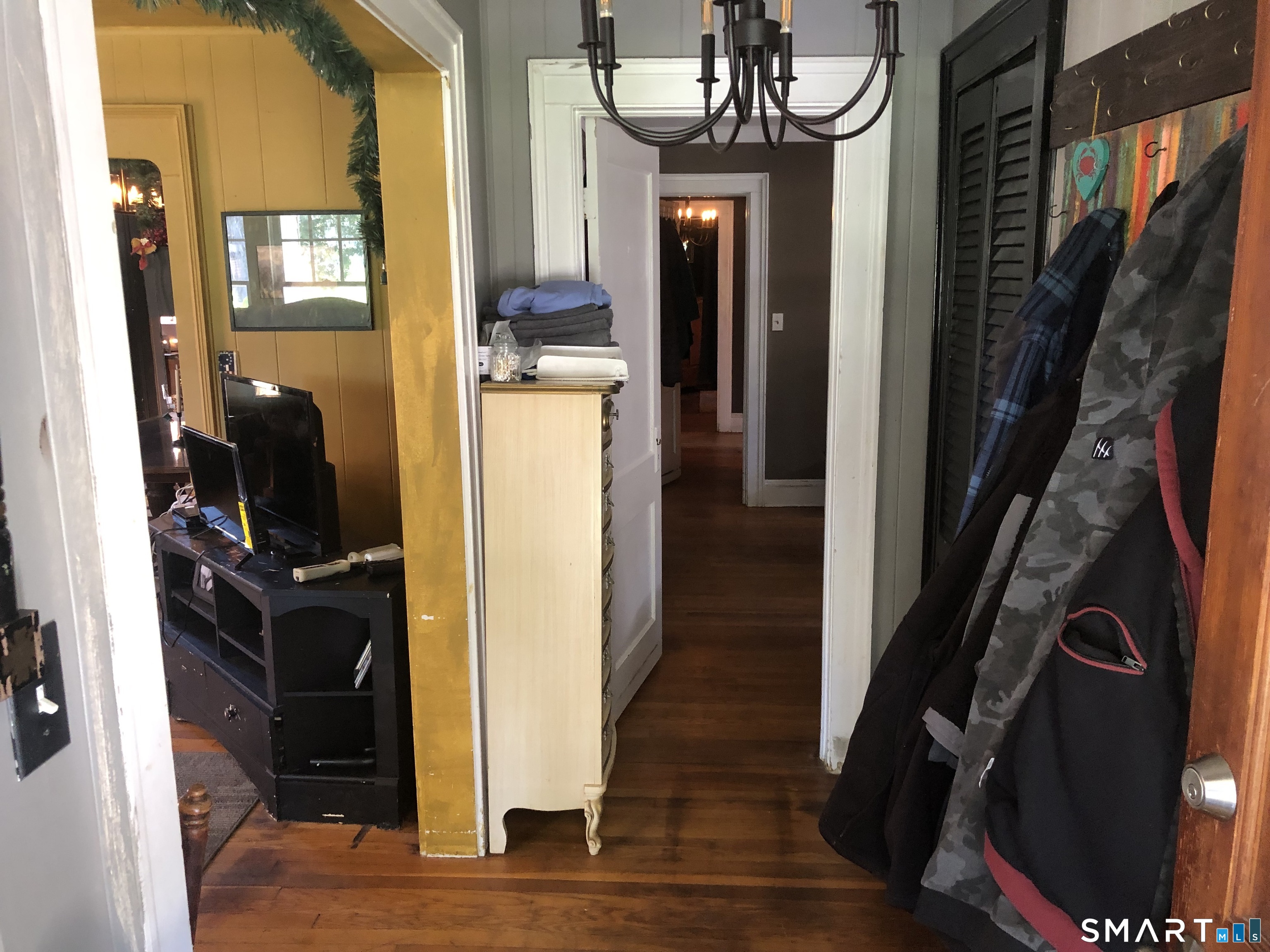 317-319 Garden Street Wethersfield, CT 06109 - Photo 2 of 24 a view of a hallway with wooden floor and staircase