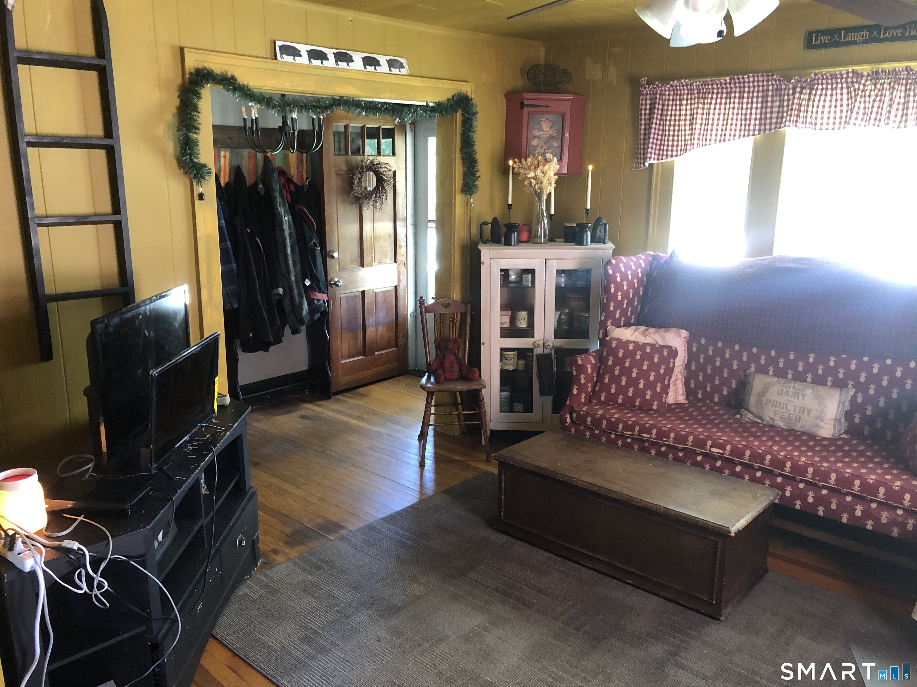 317-319 Garden Street Wethersfield, CT 06109 - Photo 4 of 24 a living room with furniture a window and a flat screen tv