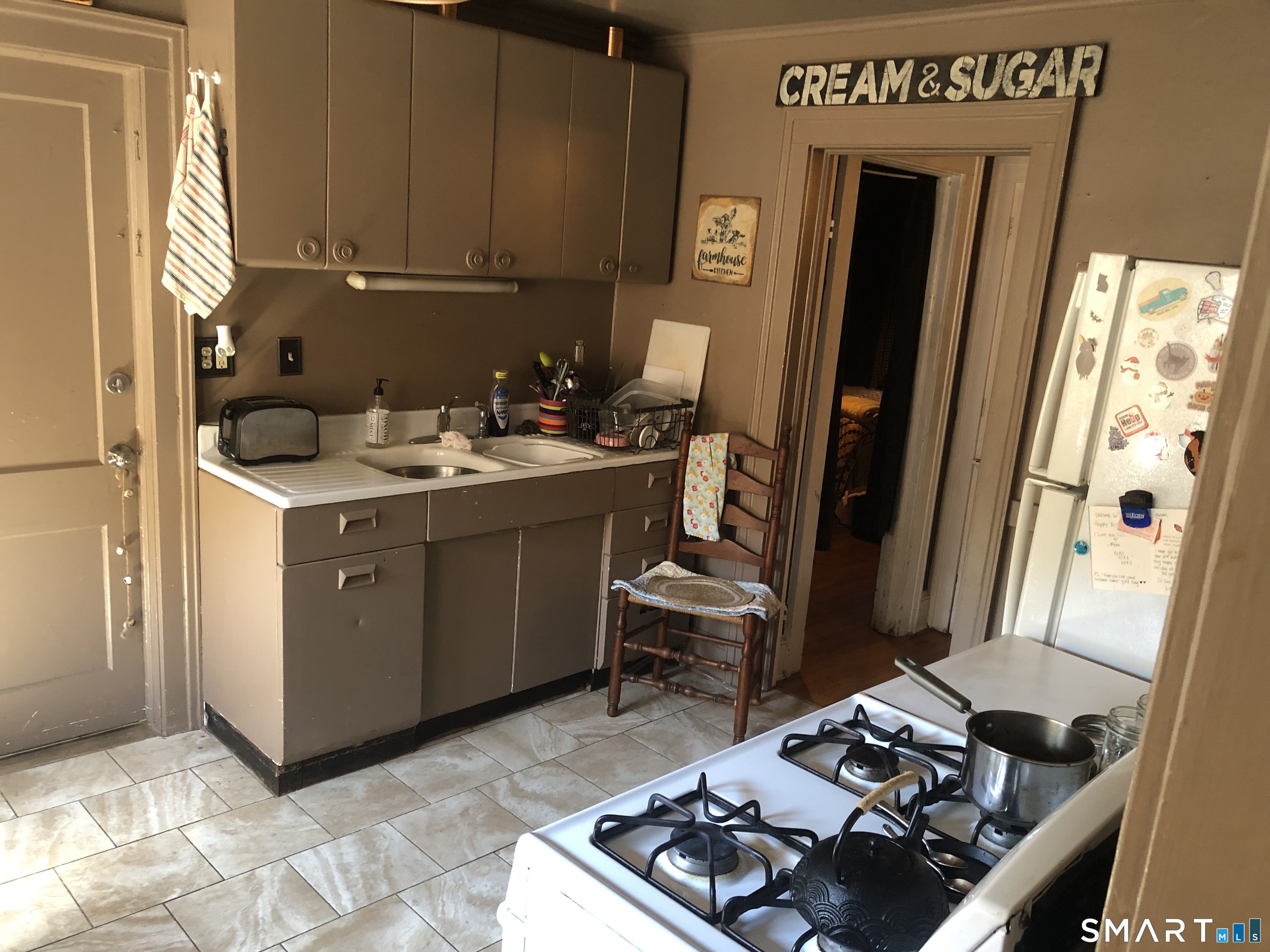 317-319 Garden Street Wethersfield, CT 06109 - Photo 6 of 24 a room with furniture and a window