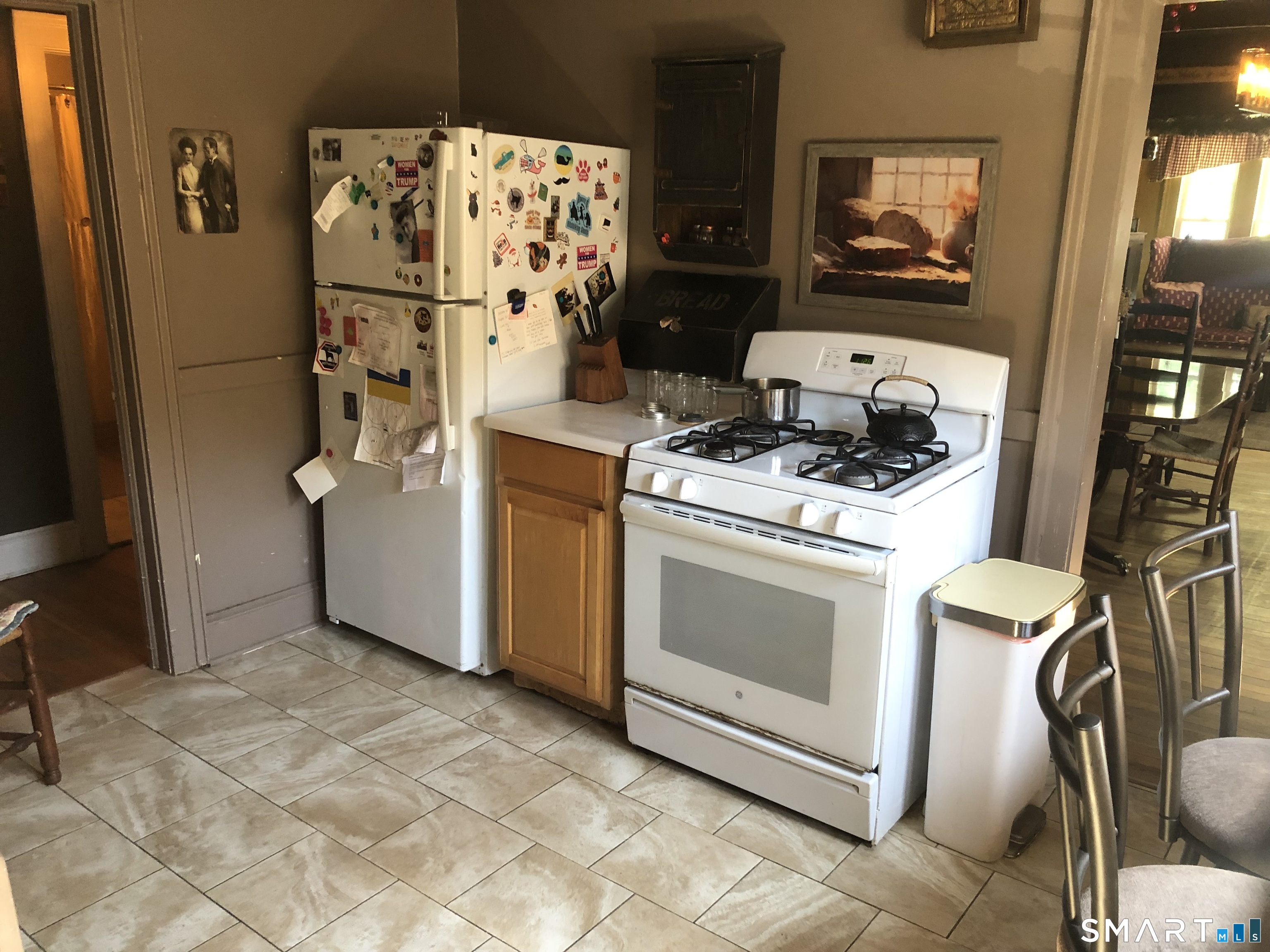 317-319 Garden Street Wethersfield, CT 06109 - Photo 7 of 24 a kitchen with stainless steel appliances a stove a refrigerator and cabinets