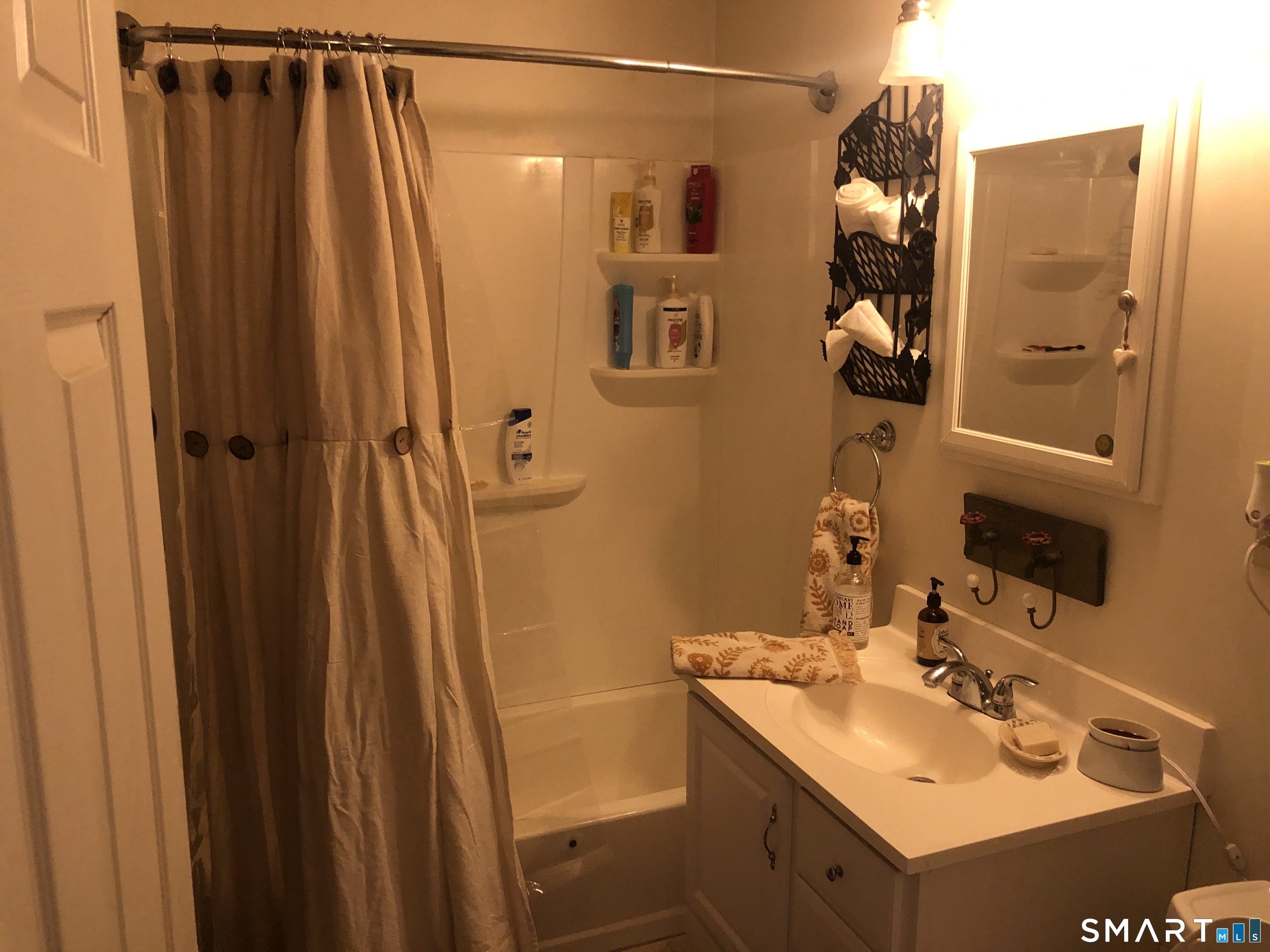 317-319 Garden Street Wethersfield, CT 06109 - Photo 10 of 24 a bathroom with a sink vanity and shower