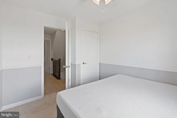 a bedroom with a bed and a hallway