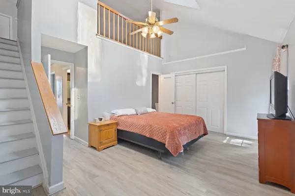 a room with a bed and a flat screen tv