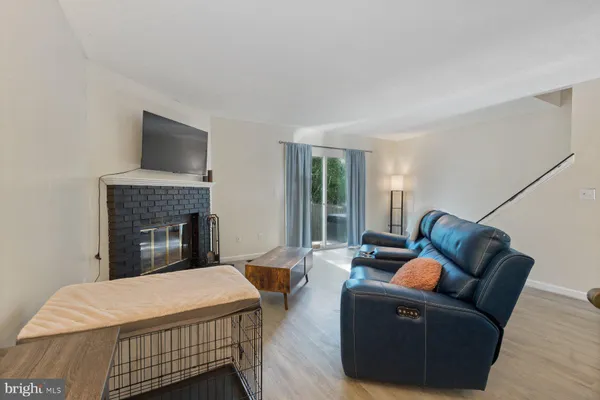 a bedroom with a bed a couch and dresser
