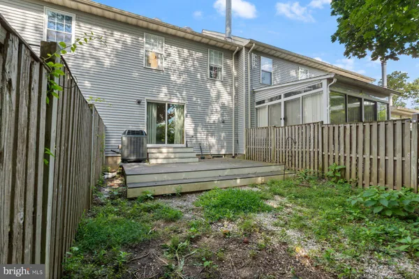a view of a brick house with a yard