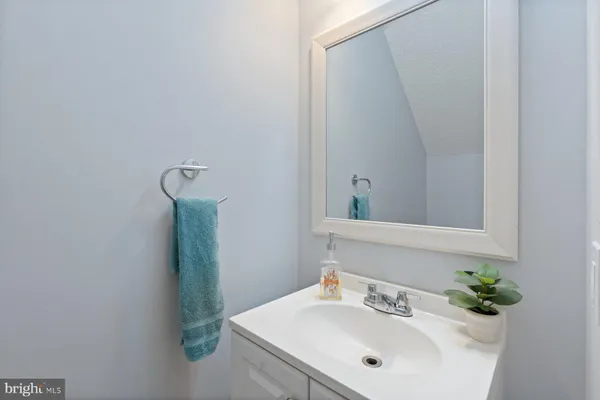 a bathroom with a sink and mirror