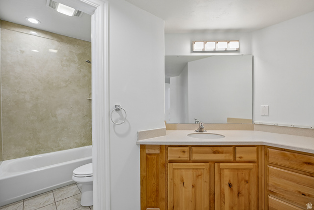 220 East Ridge Road Orem, UT 84057 - Photo 34 of 52 Wood-finish vanity with a light-toned countertop, integrated sink, and chrome faucet