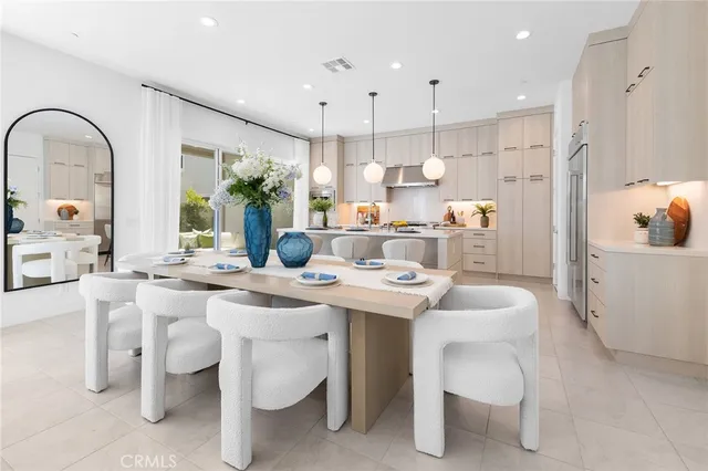 a kitchen with a sink white cabinets and stove
