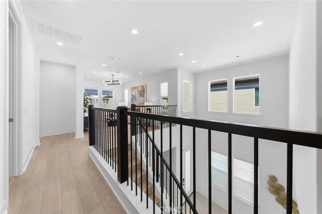 a bathroom with a double vanity sink a mirror and a bathtub
