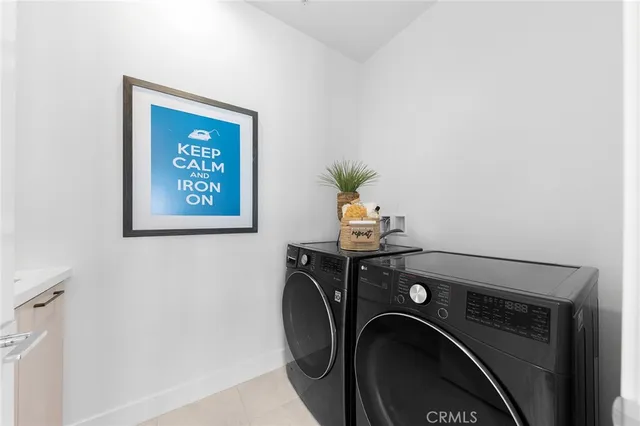 a very nice looking dining room with a large window and a table