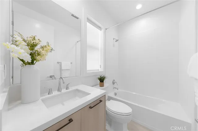 an aerial view of residential houses with city view