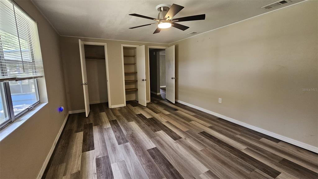 36850 Haynes Road Fruitland Park, FL 34731 - Photo 12 of 28 a view of a room with wooden floor