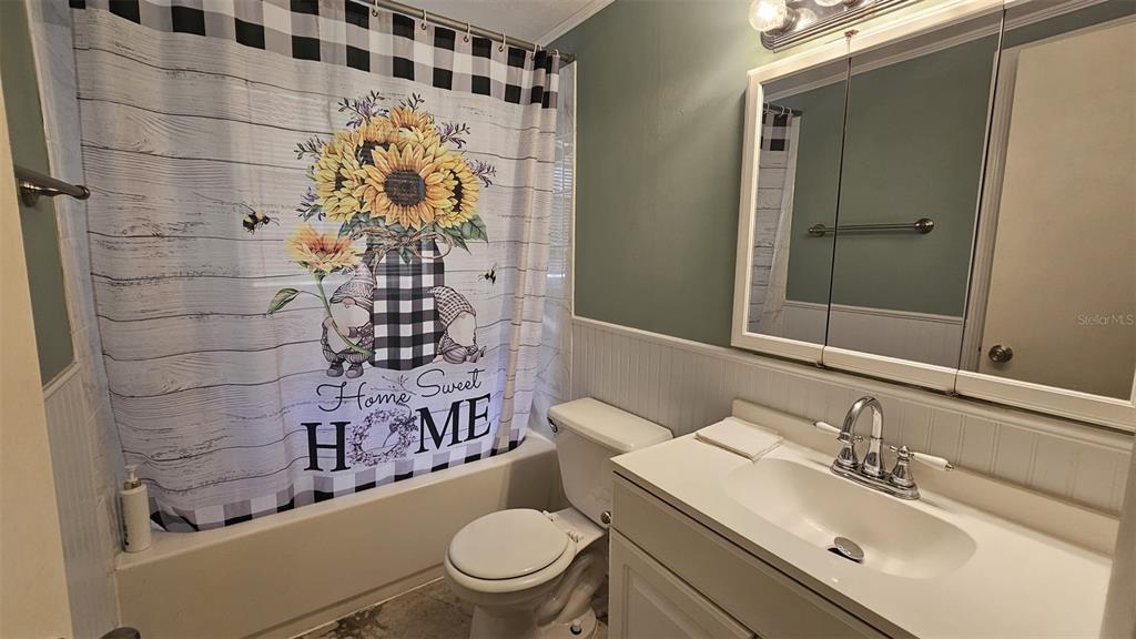 36850 Haynes Road Fruitland Park, FL 34731 - Photo 13 of 28 a bathroom with a sink toilet and shower