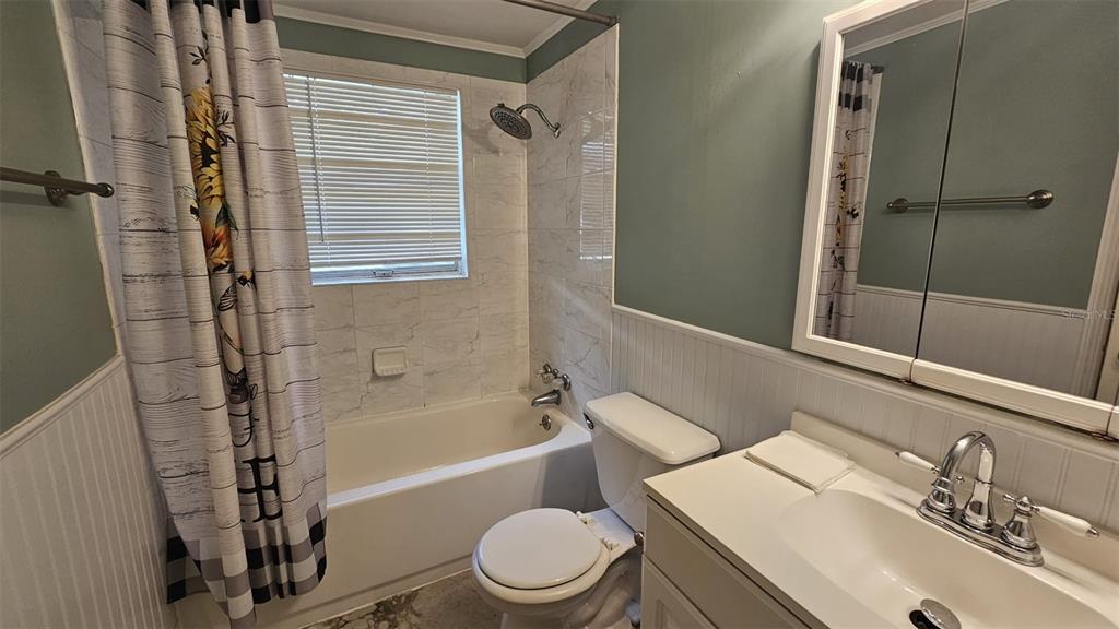 36850 Haynes Road Fruitland Park, FL 34731 - Photo 14 of 28 a bathroom with a sink toilet and shower