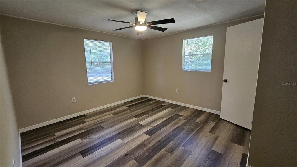36850 Haynes Road Fruitland Park, FL 34731 - Photo 15 of 28 a view of an empty room with a window