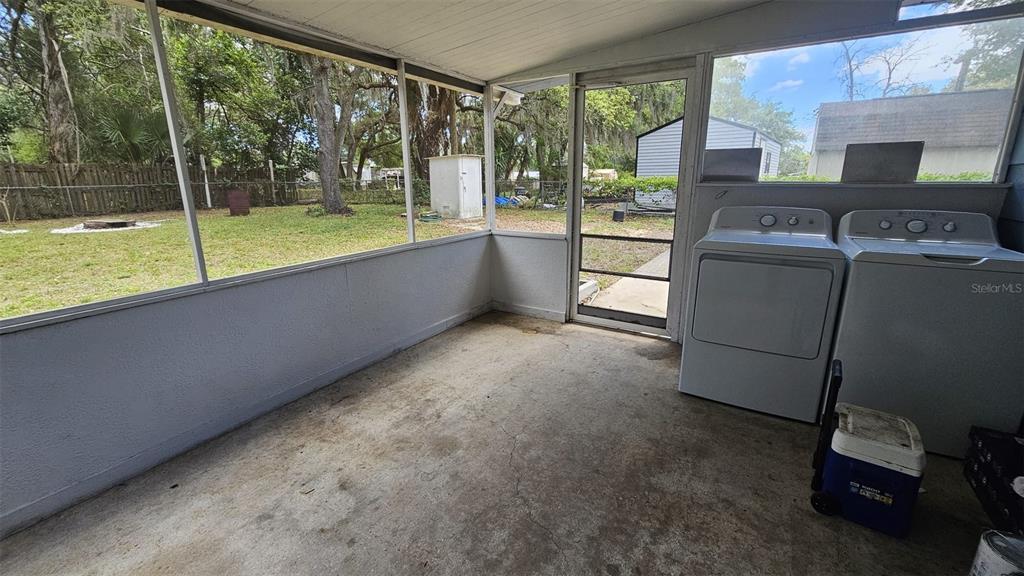 36850 Haynes Road Fruitland Park, FL 34731 - Photo 17 of 28 a view of a living room and microwave