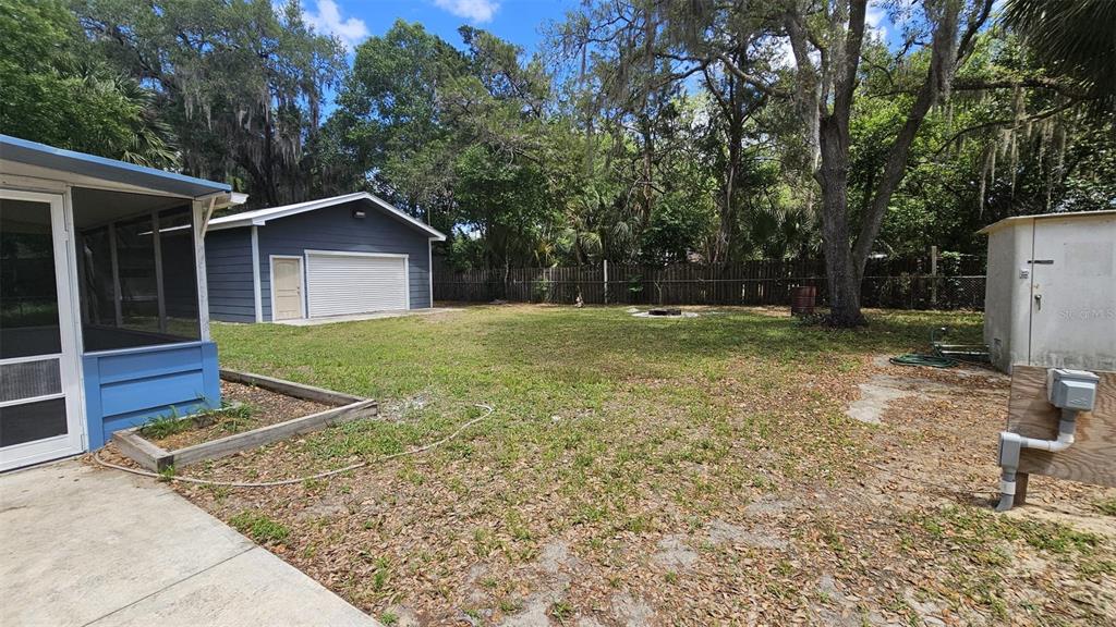 36850 Haynes Road Fruitland Park, FL 34731 - Photo 20 of 28 a view of a house with a yard and large tree